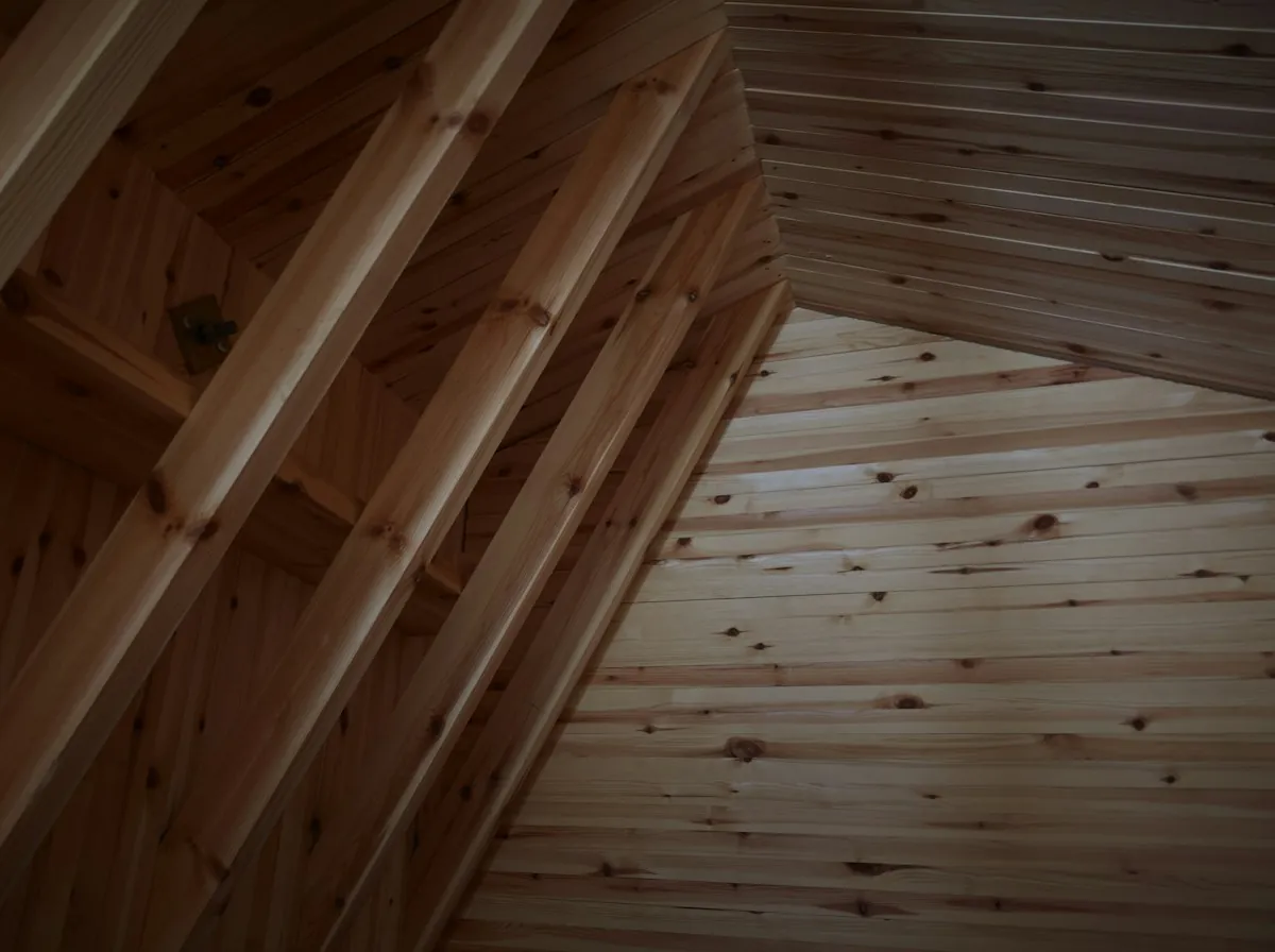 Roof Replacement in Glendale — pine boards lining the slope of an attic ceiling