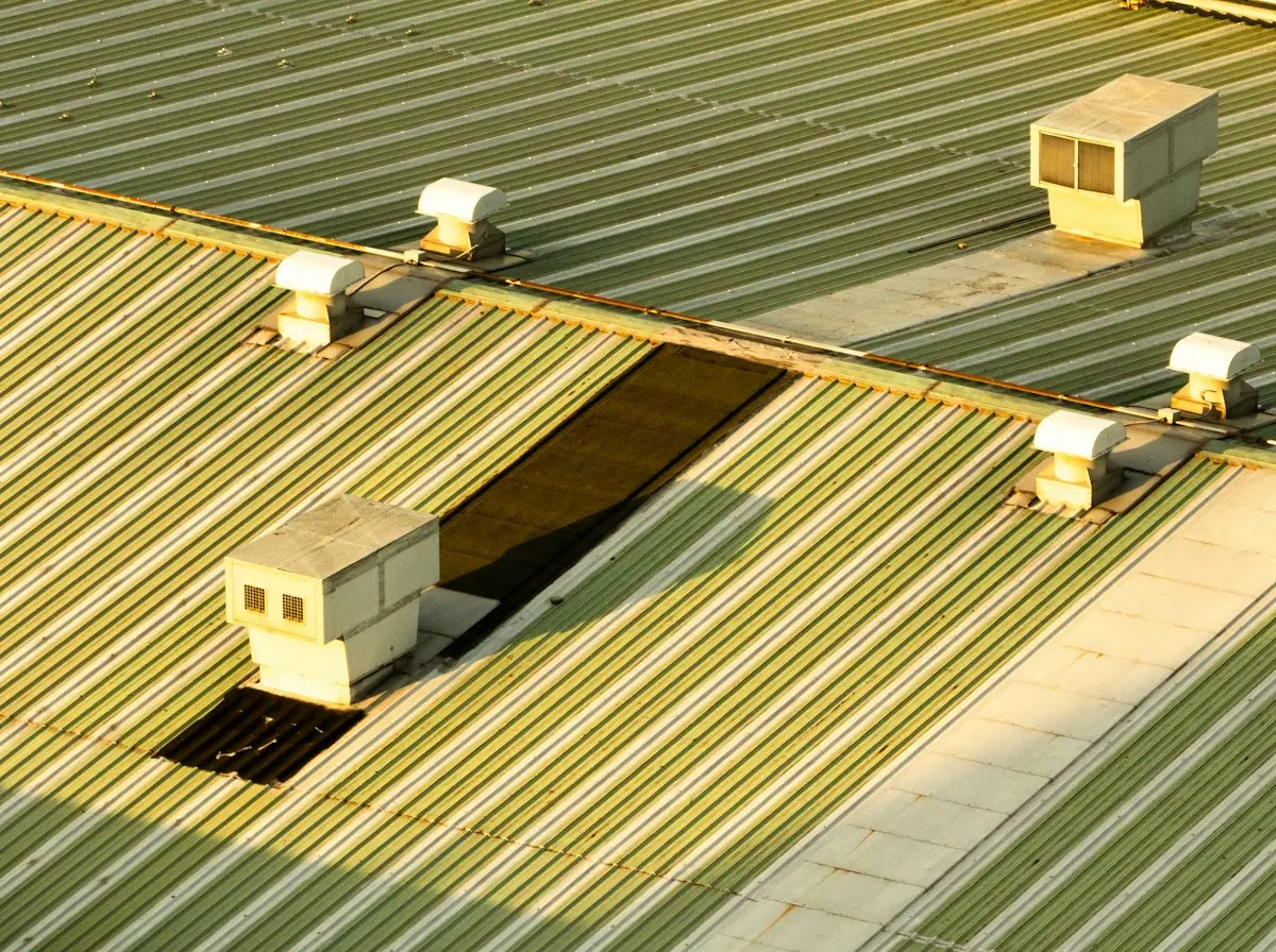 Flat Roof Replacement in Glendale — roof vents on a low-slope metal roof