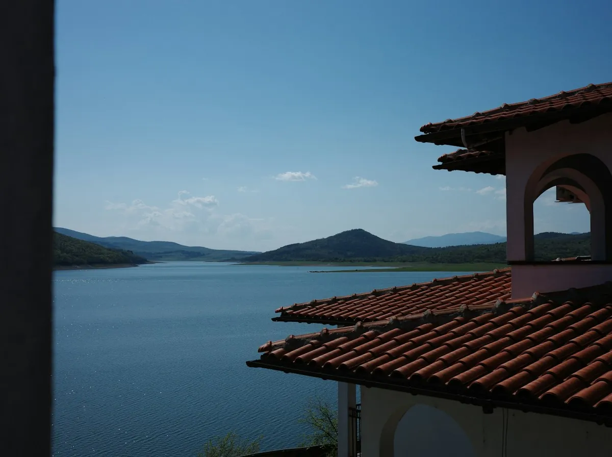 Roof Replacement in Glendale — a red tile roof overlooking a lake